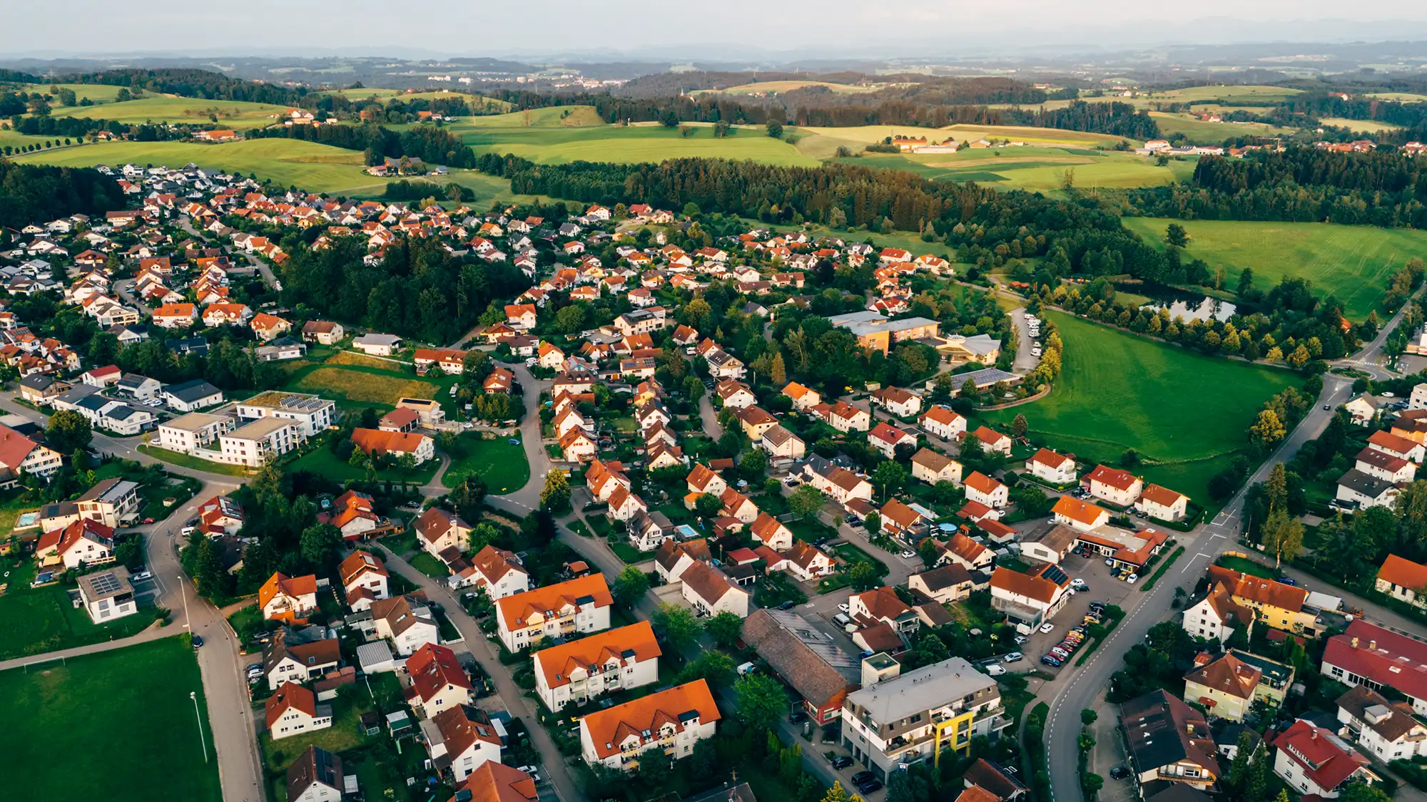 imh gmbh hausverwaltung bad kreuznach aerial view of suburban area and agricultural land